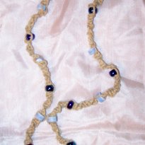 A picture of a hand-made macrame choker made from hemp