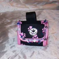 One sample of a "Diamonz in the Ruff" Doggie Doo-Doo bag in pink. All bags can be customized to your desires, including different charms & many different styles of letters to add your pet's name. These bags aren't just limited to dogs, you